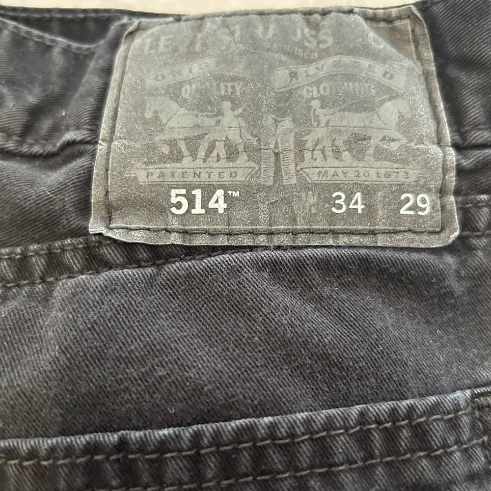 Levi’s 514 Faded Black Denim Jeans size 34x29